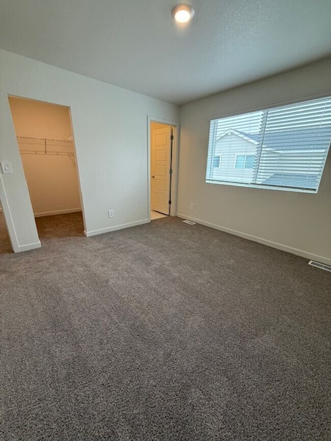 Building Photo - New 2 Bedroom Townhome + 2 Car Garage