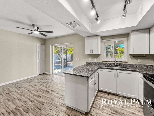 Building Photo - Tree-Lined 2BR/1BA Fort Myers Duplex with Fenced Yard, Storage Shed & In-Unit Laundry!