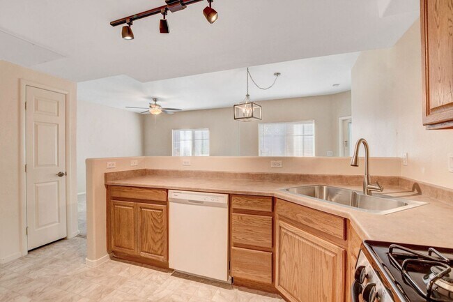 Building Photo - FIRST FLOOR CONDO IN GATED COMMUNITY W/ SINGLE CAR GARAGE