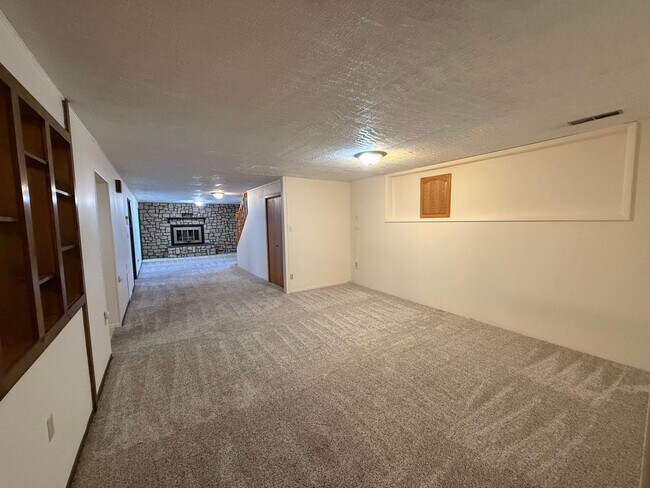 Building Photo - Spacious, four-bedroom, two-bathroom, coun...