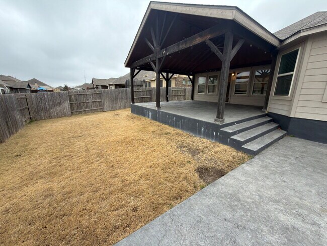 Building Photo - Four bed two bath on a corner lot with a pool in Sunfield. Gas cook top, double ovens. Open kitch...