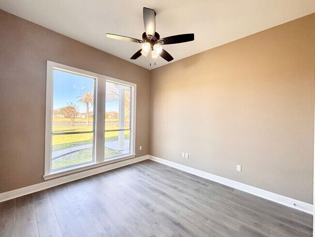 Building Photo - Stunning 5-Bedroom Home with Breathtaking Lake & Golf Course Views – Pelican Point Subdivision