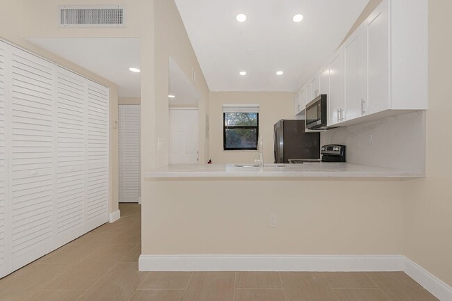 Building Photo - Fully Renovated Corner 1/1 “Villa” with Ba...