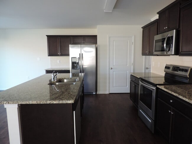 Building Photo - New, 4 bedroom home in the Hallstead commu...