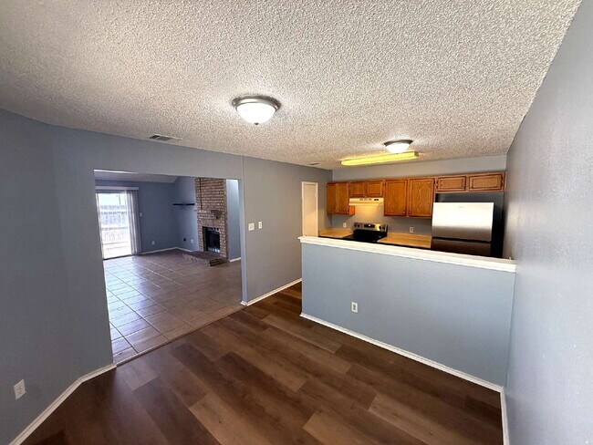 Building Photo - Move-In Ready 3BR/2BA: Updated Kitchen, New Light Fixtures & Fenced Yard