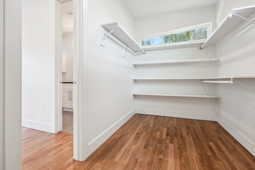 Walk-in Master closet with custom shelving - 428 W Solidelle St