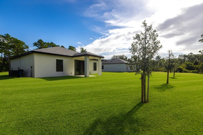 Building Photo - Brand New 4-Bedroom Gem with 2 Full Baths on Large Lot in Lehigh Acres – A Perfect Family Haven!