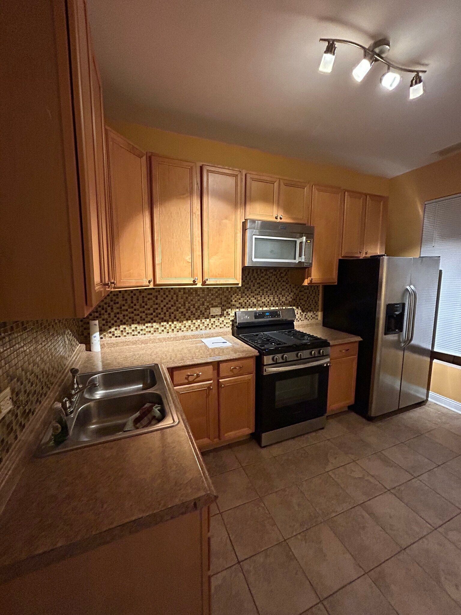 Kitchen featuring SS Appliances - 6630 S Ingleside Ave