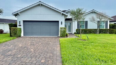 Building Photo - Rare Lakefront Pool Home in Exclusive Gated Sandhill Lake – Resort-Style Living Awaits