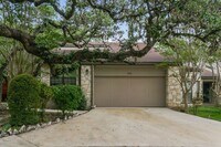 Building Photo - Charming 2-Bedroom Condo in Gated Community Surrounded by Mature Trees