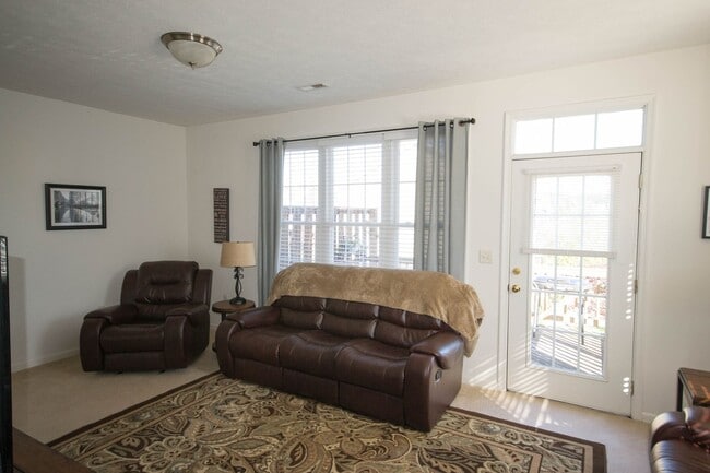 Building Photo - End Unit Townhouse With Garage and Unfinis...
