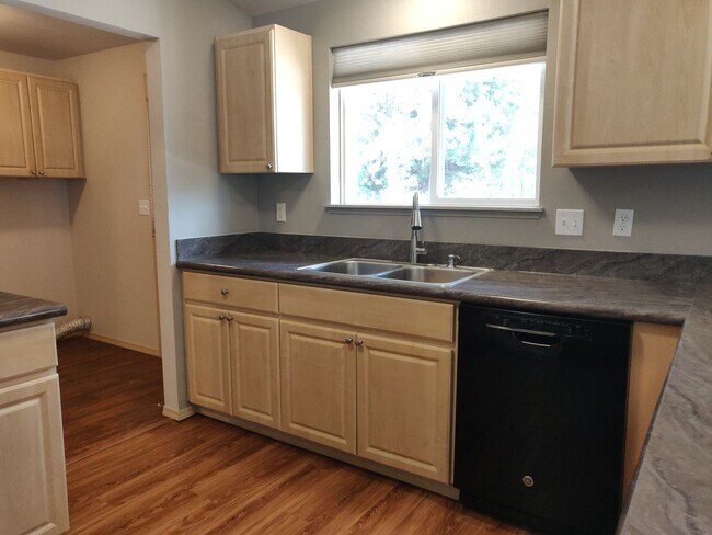 Building Photo - Charming 4-Bedroom Home on 1/2 Acre with a Fenced Backyard, Fully Insulated Double-Car Garage, in...