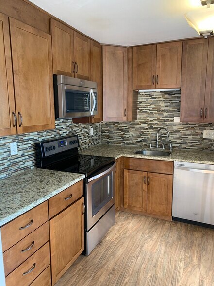 Stainless steal appliances, granite counters and soft close drawers - 790 N Washington St