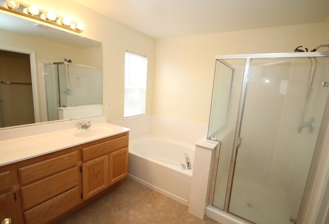 Building Photo - 4 Bed| 2.5 Bath | 2061 SF | 2 Car Garage | Long driveway with gate | Tenant pays $175 monthly for...