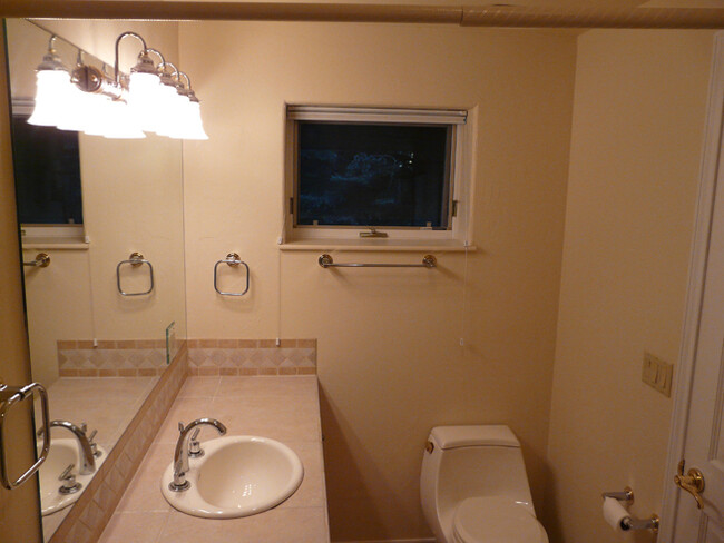 Bathroom sink, toilet, vent fan & window - 46 Heather Ln