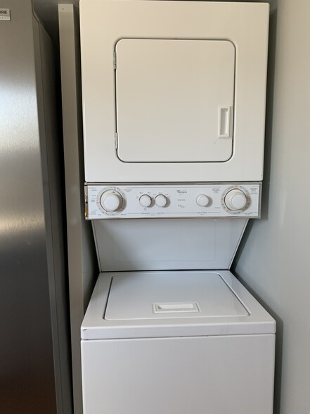 Stack-able Washer & Dryer and a Dishwasher next to sink. Storage shelf on top of area. - 97 Washington street