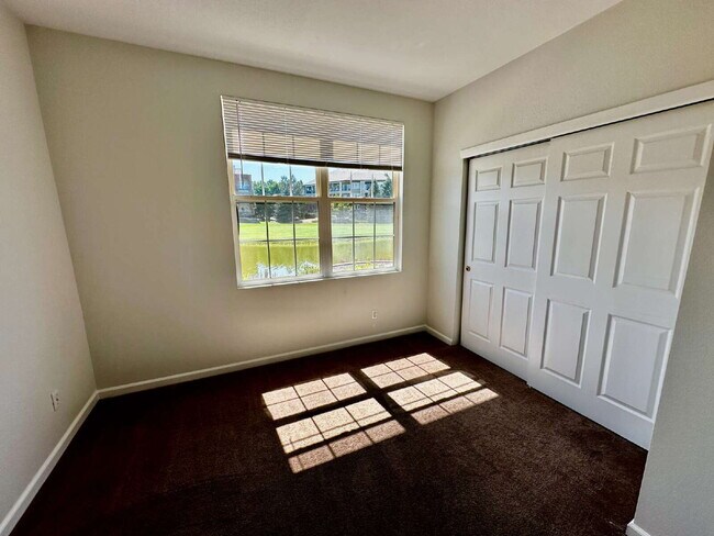 Building Photo - "Spacious 2-Bed, 2-Bath Condo with Pool Ac...