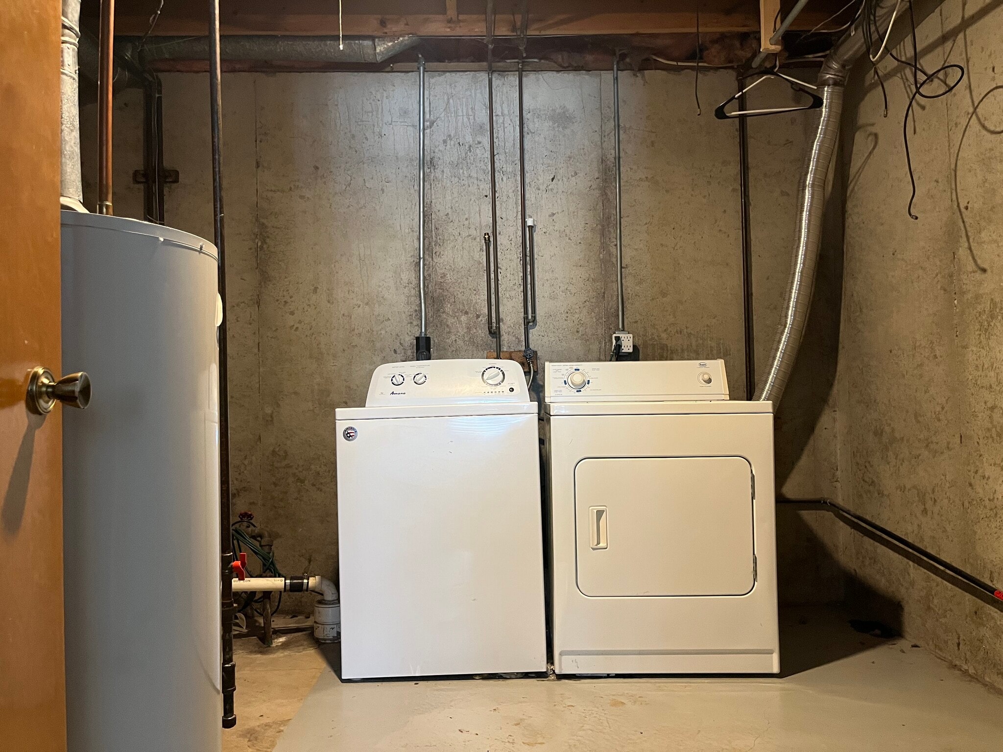 Basement laundry area with washer, dryer, and utility space - 4417 Poinsettia Ave SE
