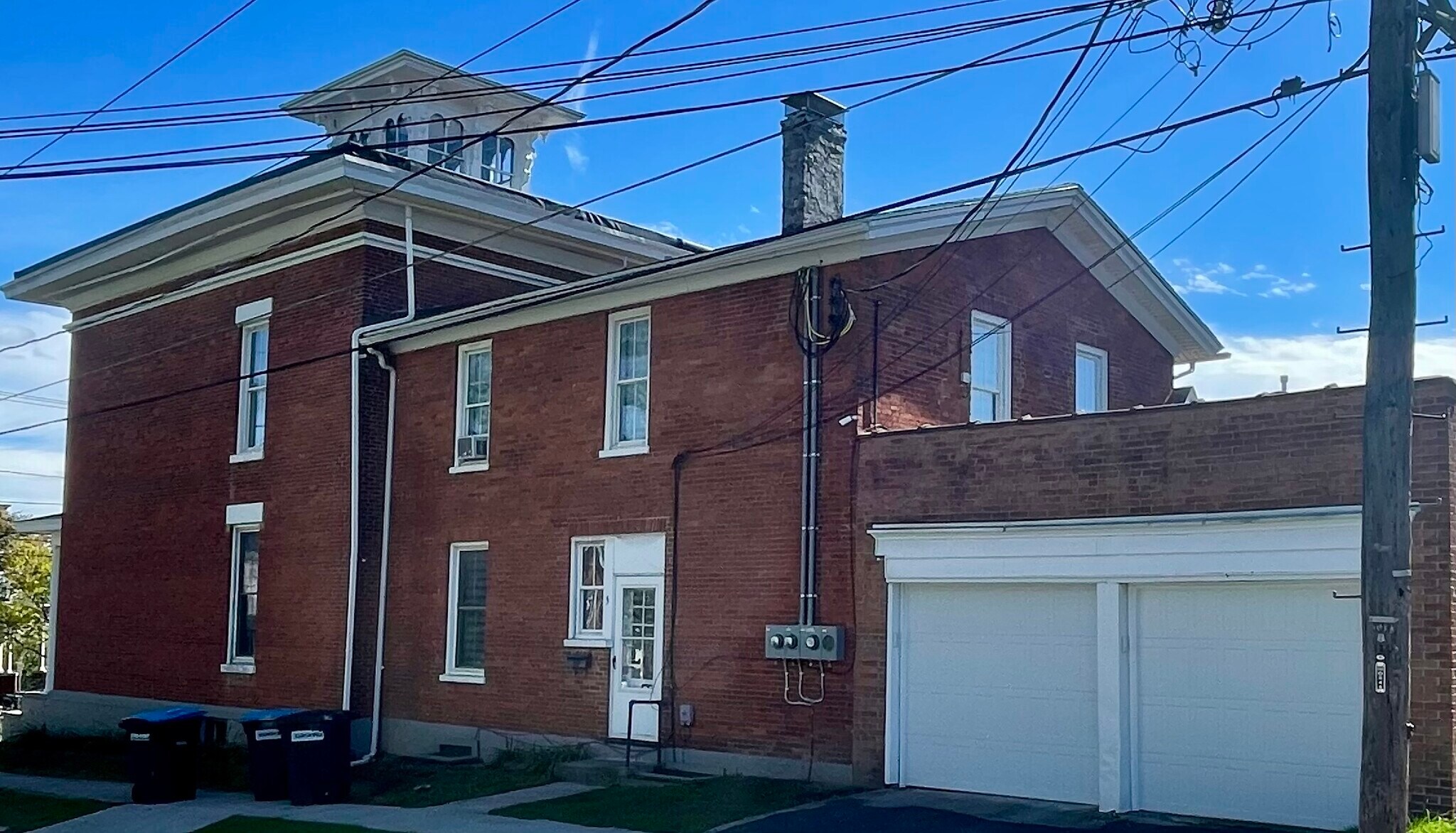 Entrance to property and garage with one parking space for this apartment unit 3 - 52 Genesee St