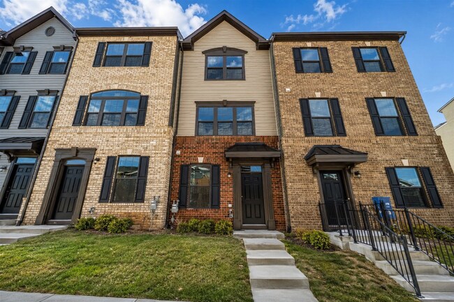 Building Photo - This 3-bedroom, 3-full bathroom townhouse offers a pristine and contemporary living experience.