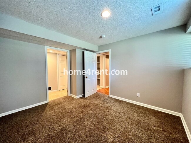 Building Photo - Updated Kitchen, Large Two Tiered Deck, Finished Basement in Blue Valley Schools!
