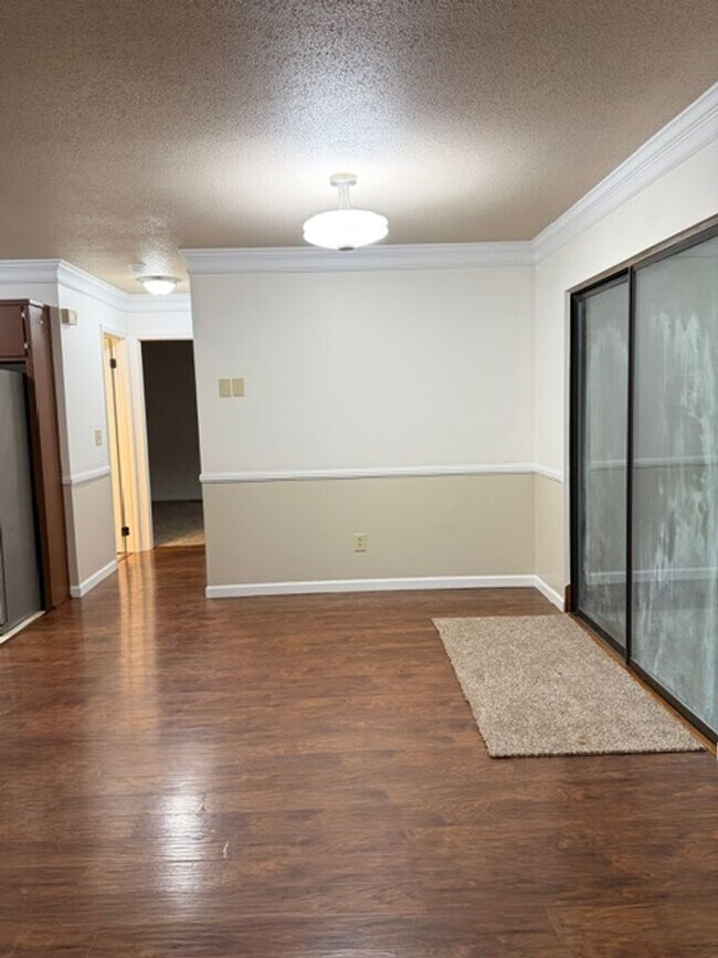 Building Photo - 2 Bedroom 1 Bath Duplex with garage/basement, side porch, and carport.