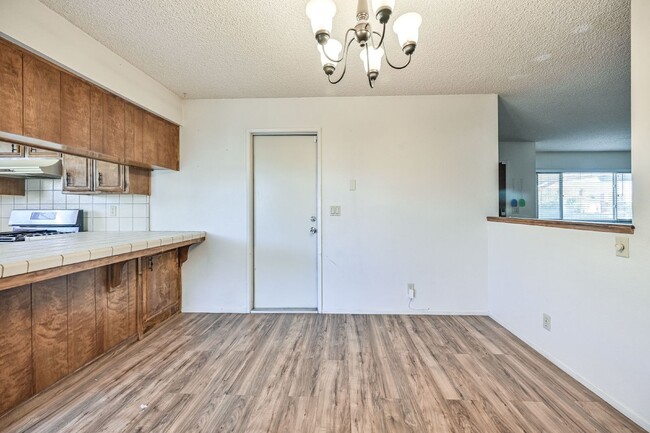 Building Photo - 3 bedroom, 2 bath with large living room and brick fireplace.  Good size kitchen with tons of cab...