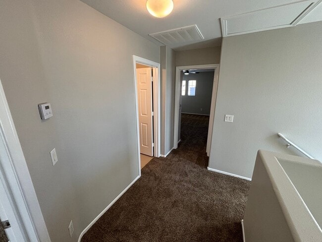 Building Photo - Spacious Tri-Level 4-Bedroom Home with Bal...