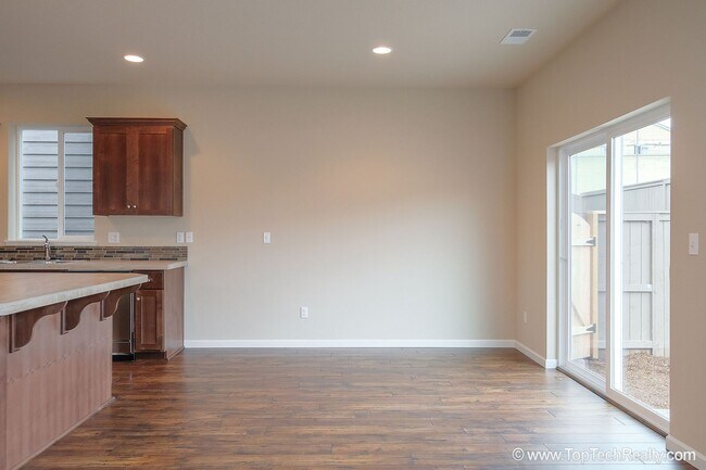 Building Photo - Spacious 4-Bedroom + Office Home in Abbey Creek – Modern Finishes, EV Charger & Low-Maintenance B...