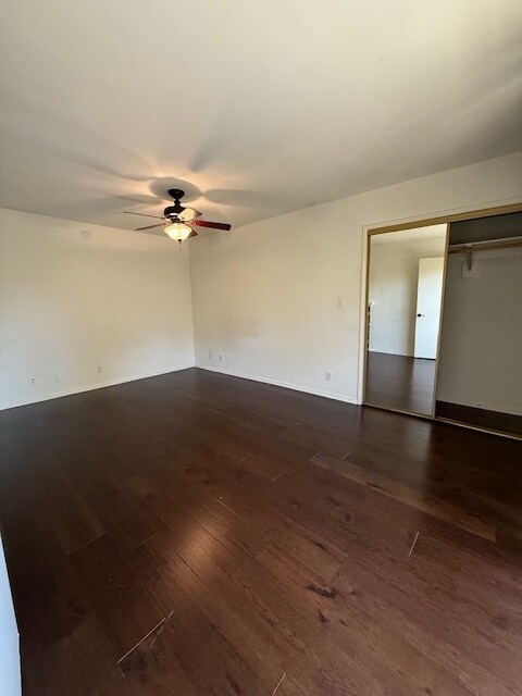 Front bedroom with hardwood floors - 10481 Riverside Dr