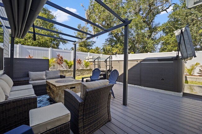 Building Photo - "Luxurious Furnished Home with 4-Bed, 3-Bath, Swim Spa Fenced Yard Golf Cart steps to the beach!"