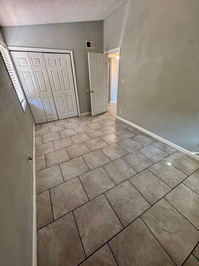 Building Photo - Charming 3-bedroom, 1-bath home featuring an attached carport and a fully fenced backyard—perfect...