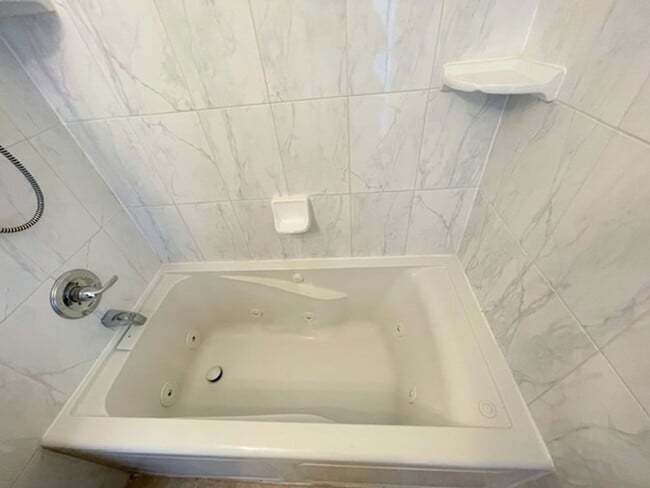 Building Photo - RARE FIND! Spacious and bright three bedro...