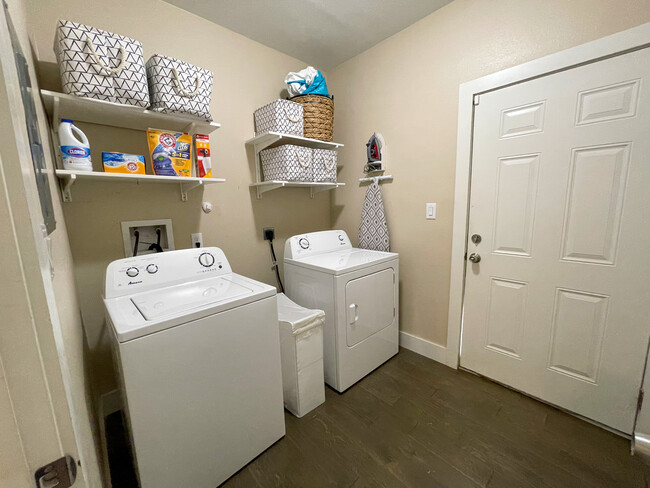 Laundry room with storage closet. - 422 S Olive St