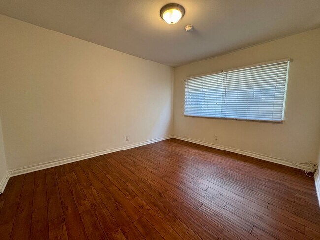Building Photo - Updated Lower apartment with Hardwood Floo...