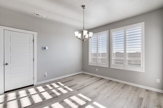 Building Photo - Custom Hunter-Douglas shutters throughout.