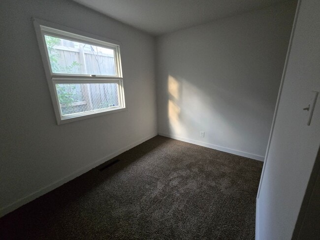 Building Photo - 3 bed 1 bath W/ back yard bunker!