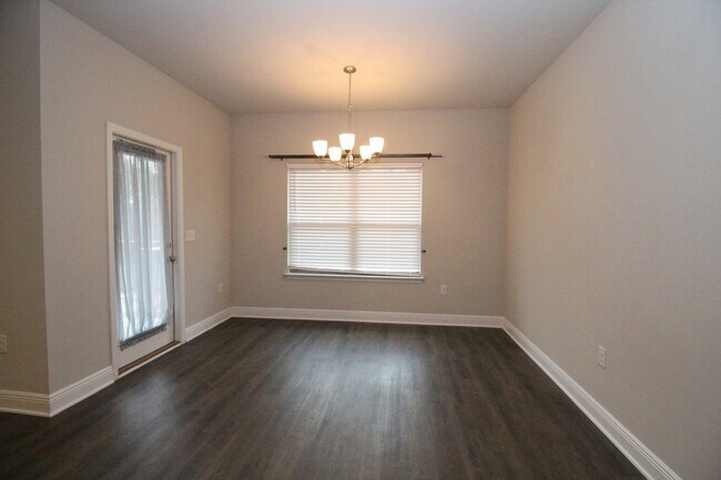 Building Photo - Pace 3/2 Home with Open Layout & Fenced Ya...