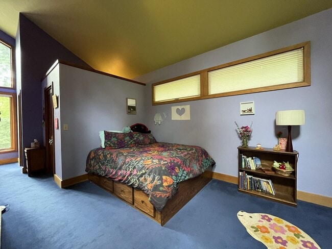 Building Photo - One-of-a-Kind Custom Home with Wall of Windows, Stone Fireplaces, Expansive Entertainment Space &...