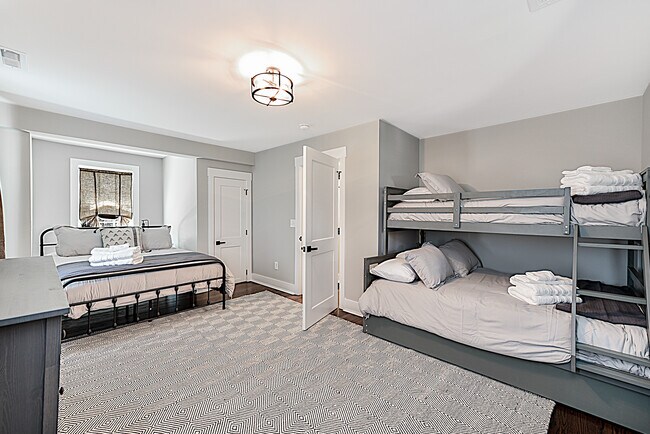 Second floor bedroom with Queen size bed and full/twin bunk beds. - 2118 Market St