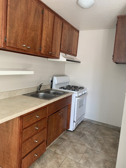 kitchen cabinets are now painted gray - 516 W Atkins Ave