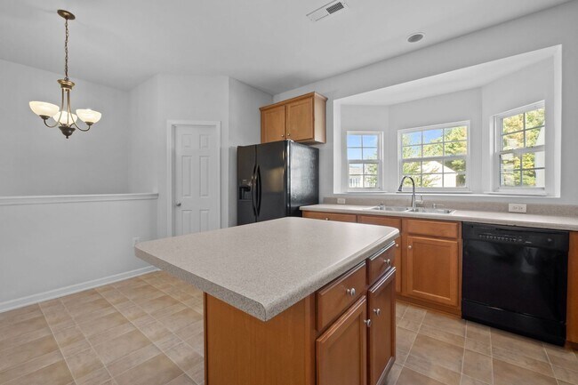 Building Photo - Spacious 3-Story End-Unit Townhome Near RTP