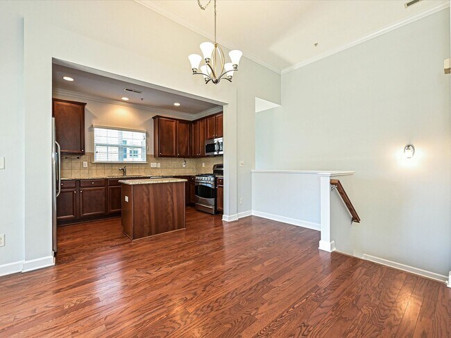 Building Photo - Stylish Condo Living with Open Concept, Garage & Outdoor Space