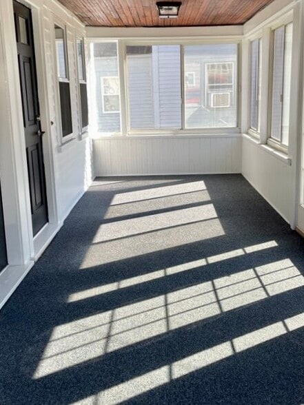 A view of the shared sunporch with secondary entrance to the unit. - 20 Chapel St