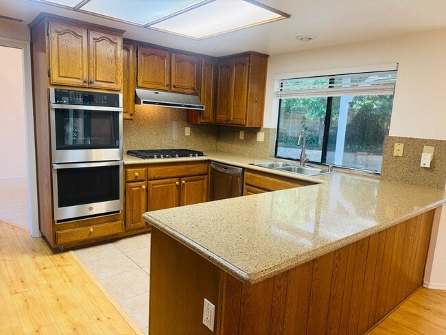 Building Photo - Beautifully Remodeled Lang Ranch Home – Steps from Top-Rated School