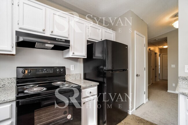 Building Photo - This home exudes a cheerful and welcoming charm!