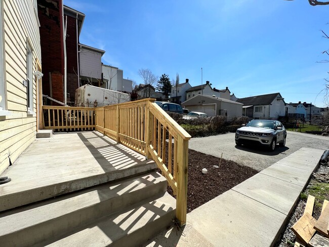 Building Photo - Updated 3BR house with multi-car off street parking!