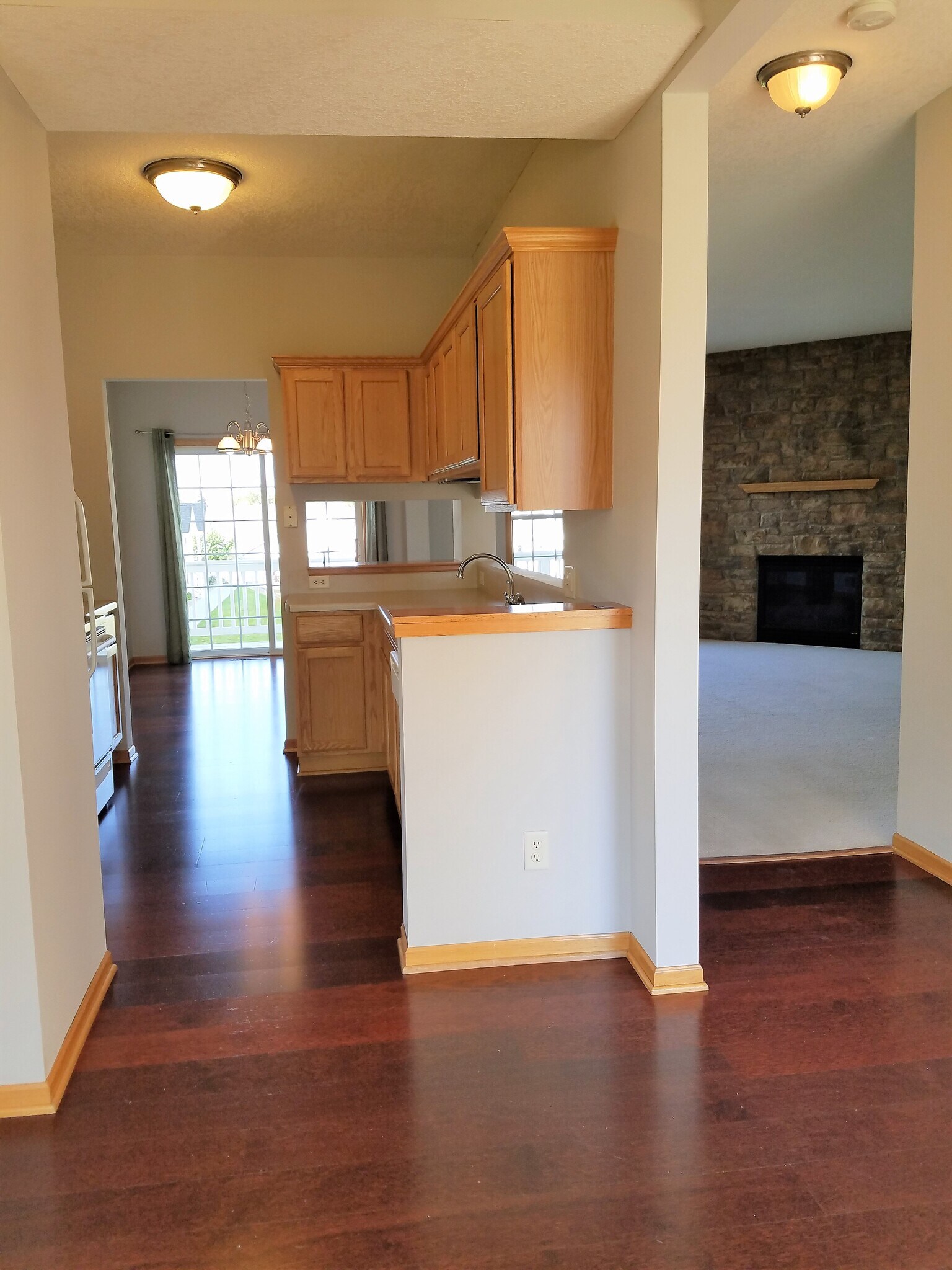 From kitchen nook facing dining room and living room - 2407 Foxglove Cir