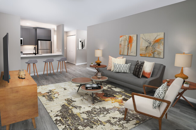 Renovated Package II living, dining, and kitchen areas with hard surface plank flooring - Avalon Midtown West