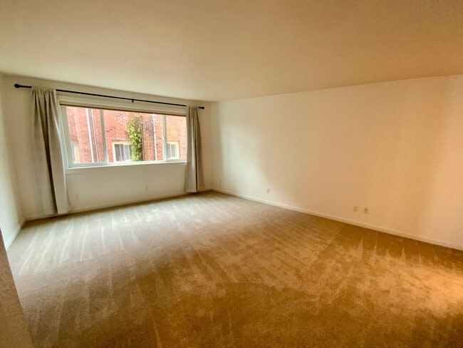 Building Photo - 1,300+ Sq Ft 2BR Condo w/ Parking, W/D & Utilities Included | $1,000 Move-In Credit